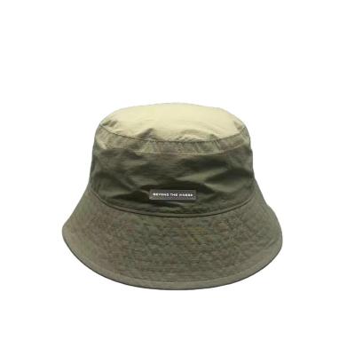 China Image High Quality Outdoor Black Nylon  Bucket Hat with Rubber Patch Logo for sale