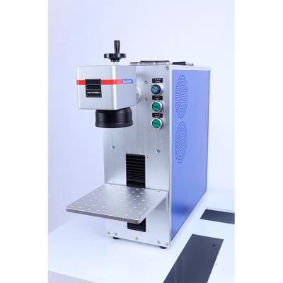 China Small Size 20w Laser Marking Fiber Optic Machine On Metal For Jewelry Logo Golden for sale