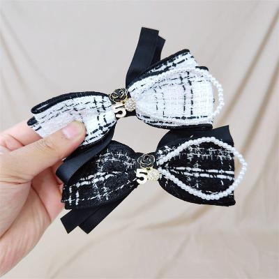 China Hair Accessories Design Camellia Designer Scrunchies Hair Clips Elastic Band Hair Clips Korean Classic Famous Scrunchies Brands Luxury Hair Scrunchies for sale