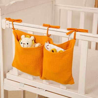 China Eco-Friendly Newborn Hanging Organizer Toy Diaper Pocket Nappy Store Crib 2 Pockets Crib Storage Crib Bags Cotton Multifunctional Bags for sale