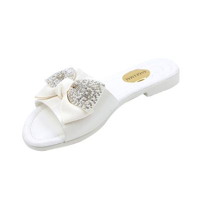 China SHOCK ABSORBING Hot Sale Non-slip Comfortable Flat Women's Sandals Round Toe Other Sandals Diamond Bowknot Slippers For Women And Ladies for sale