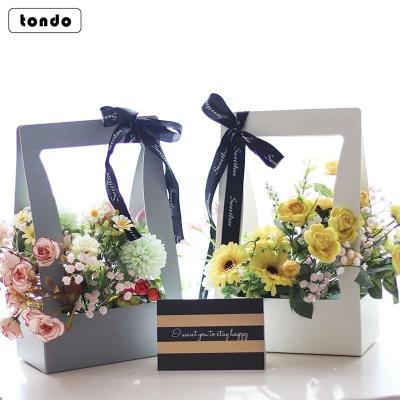 China Handmade Tondo Paper Flower Plant Bag Plant Florist Bouquet Handle Flower Waterproof Bag Packaging for sale