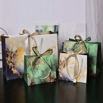 China Luxury Custom Logo Shopping Paper Bag Printed Retail Gift Craft Jewelry Cosmetic for sale