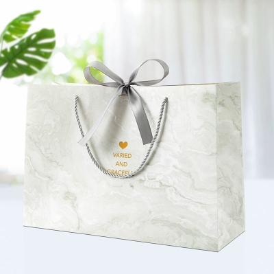 China Business Cosmetics Jewelry Packaging Bags Shopping Bags Gift Paper Bag With Ribbon Bow for sale