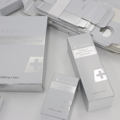 China High-Grade Silver Skin Care Packaging Box Cosmetic Essential Oil Mask Packing Box Printed Logo for sale