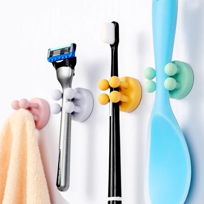 China Adhesive Hook Bathroom Toothbrush Hook Kitchen Razor Hook Desk Cable Organizer Nail Free Silicone Hook for sale