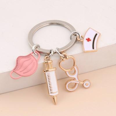 China Wholesale Beautiful Wind Enamel Metal Nurse Customized Nurse Keychain Syringe Stethoscope Facemask Key Chain Keyrings for sale