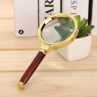 China Zoom in handheld magnifying glass, suitable for jewelry, newspaper, book reading high definition glasses, portable for sale