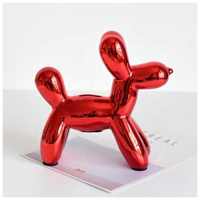 China Nordic Handcrafted Ceramic Dog Shaped Piggy Bank Golden Balloon Dog Money Bank Piggy Bank For Home Decoration for sale