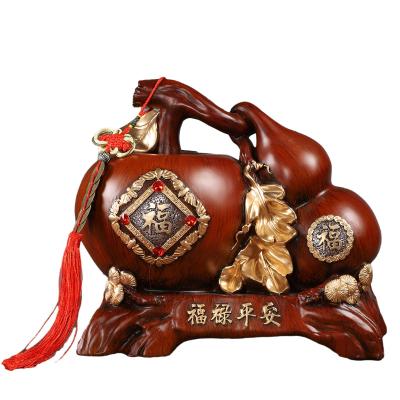 China China High End Luxury Texture Gold Wood Grain Resin Ornaments Hand Painted Fortune Apple Gourd Piggy Bank Home Decoration Gift for sale