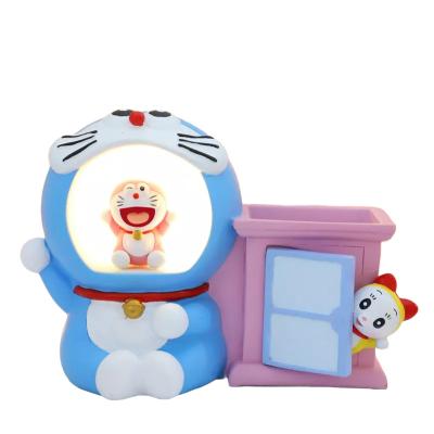 China Creative cartoon doraemon pencil holder jingle cat pen holder night light table decoration small star light student gift pen holder decoration for sale