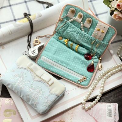 China Travel Jewelry Bag Beautiful Cosmetic Gift Jewelry Packaging Bag For Travel Earrings And Necklaces Ring Storage Bag for sale