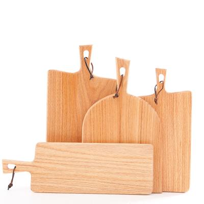 China Sustainable Wooden Chopper Oak Wood Cheese Cutting Serving Boards With Handle for sale