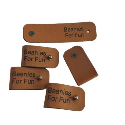 China Guangzhou Sustainable Leather Patch Factory Custom Leather Label With Own Design Label Manufacturer for sale