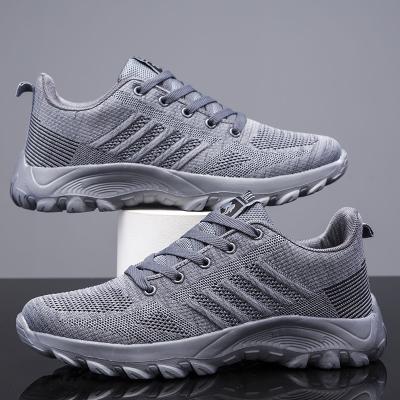 China 2020 new flying woven breathable running shoes men's cushioning running shoes for sale