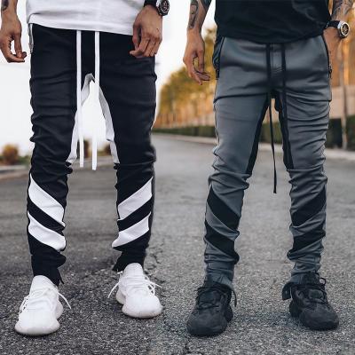 China Anti-wrinkle new men's fashion spring and autumn casual sports tend youth color straight straight running fitness suits long for sale