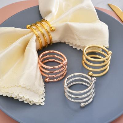 China Gold Stocked Spiral Napkin Rings New Wedding Decorations Luxury Metal Table Dinner Round Napkin Holders Loops for sale