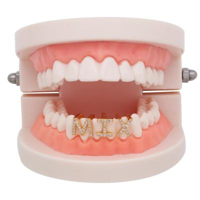 China Special Natural Zircon Brass Diamond Alphabet Single Teeth Grillz 18k Gold Plating Hip Hop Real New for sale