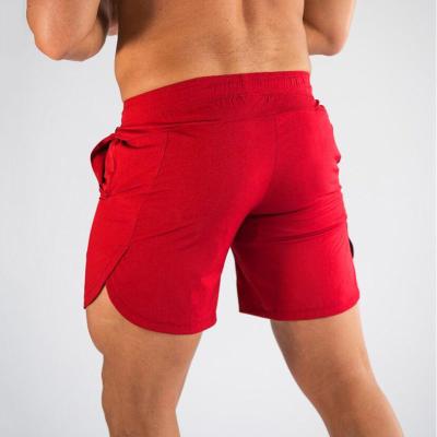 China Custom Sweated Designer Solid Color Anti-Wrinkle Cotton Breathable Cotton Polyester Fitness Boxer Gym Workout Running Cargo Men's Sports Shorts for sale