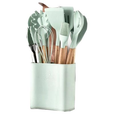 China Newest Sustainable Wooden Handle 12Pcs Silicone Kitchenware Set With Container for sale