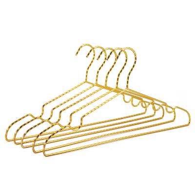 China Unique Gold Metal Wire Twisted Slim Metal Clothes Hangers for sale