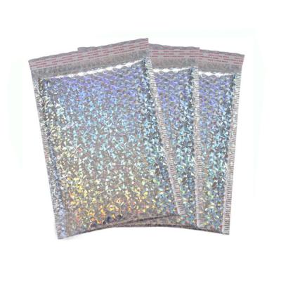 China Custom Printed Glamour Laser Film Bubble Envelope Mailing Bags Rainbow Metallic Poly Holographic Bubble Mailers for sale