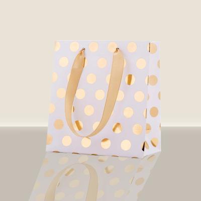 China Custom Recyclable Factory Clothing Packaging Customer Paper Bag Polka Dot Paper Bag for sale