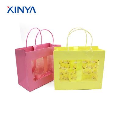 China Practical Fashionable Hot Stamping Security Kraft Perfume Package Paper Bags With Window for sale