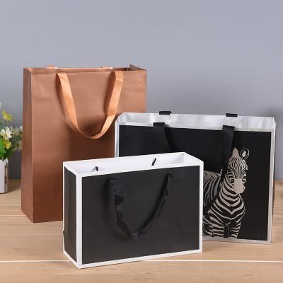 China China Manufacturer And Factory Flat Bottom Handmade Kraft Paper Bag With Rope Handle for sale