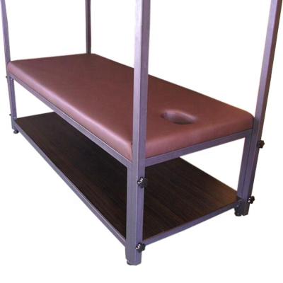 China Traditional iron frame stamping back massage table with hanging bar for sale