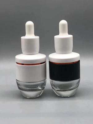 Chine Le verre cosmétique d'OEM 30ml Boston met la conception en bouteille durable de galvanoplastie UV ambre à vendre