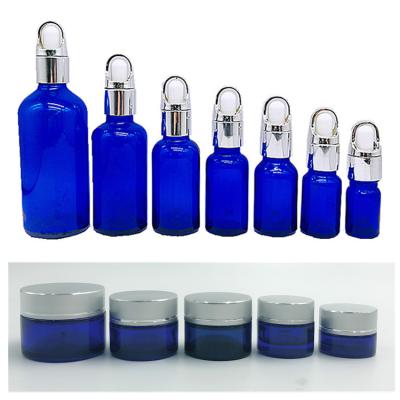 China Custom 30ml Essential Oil Cosmetic Glass Pump Bottle for sale