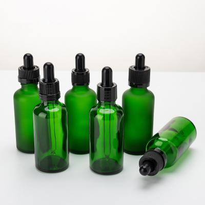 China 50ml Transparent Green Glass Cosmetic Serum Dropper Bottle For Serum for sale