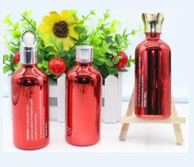 China Big Electroplating Red Aluminium Bottles For Cosmetics Oil 50ml Transparent for sale