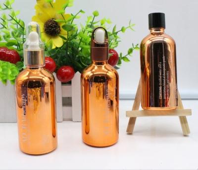 China empacotamento cosmético de vidro de galvanização UV do conta-gotas das garrafas de óleo de 15ml 30ml à venda