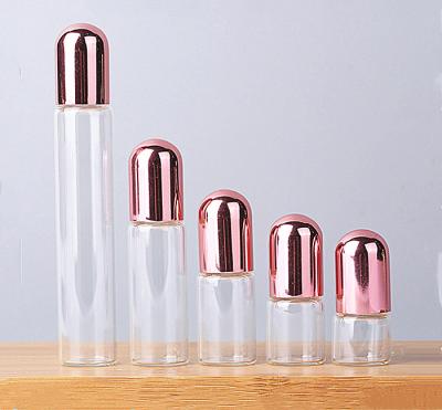 China Custom Made Glass 7ml Perfume Bottle With Aluminum Rose Gold Lid for sale