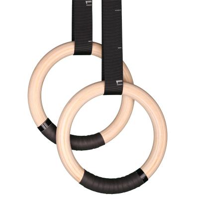 China Durable wooden gymnastic rings with adjustable straps for strength training pull ups and dips for sale