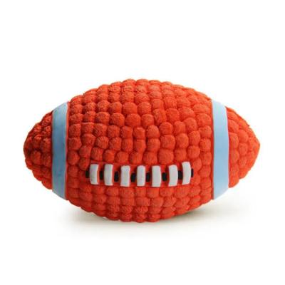 China Stocked Interactive Toy Squeaky Dog Ball Rugby Rubber Football Latex Dog Toy for sale