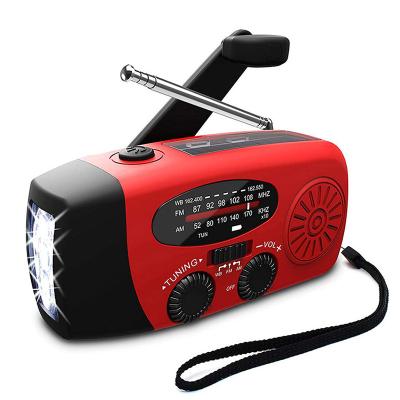 China USB PORTABLE Solar Emergency Flashlight Wind Radio Battery with Mobile Phone Charger Hand Crank Dynamo Radios for sale