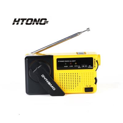 China PORTABLE compact dynamo hand crank radio flashlight, self powered, emergency siren, phone charger for sale