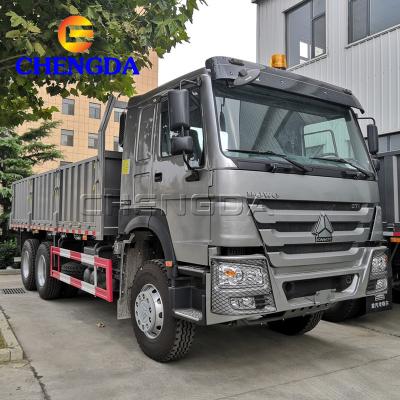 China HOWO 6x4 Cargo Truck Left Hand Drive Barrier Flatbed Truck 12200x2500x3600mm for sale