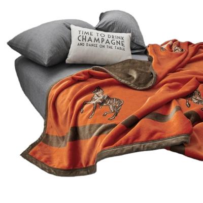 China Cheap Thick Orange Horse Pattern Process Printing Polyester Thermal Comfortable Blanket for sale