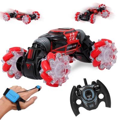 China Hand Watch /gesture Sensing Control Smart 1:16 2.4GHz Hand Watch Gesture Sensing Toy Double Sided Remote Control Stunt RC Car With Light Music for sale