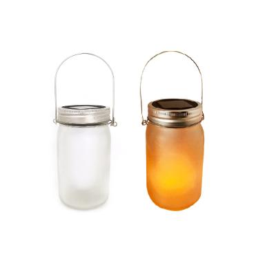 China Garden Frosted Outdoor Glass Jar Dancing Flame LED Solar Garden Lights For Decoration for sale