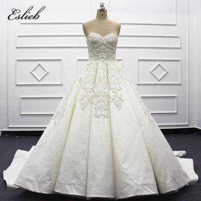 China Anti-wrinkle Luxurious Wedding Dress Beaded Embroidery Lace Beads Ivory Lace Bridal Gown Flower Dress Saudi Arabia Crystal Wedding Dress for sale