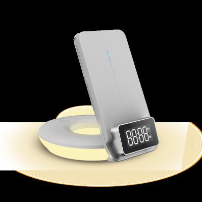 China New Arrival Table Top 4 in 1 Multifunctional Led Night Light Alarm Clock Mobile Phone Stand Wireless Charger for sale