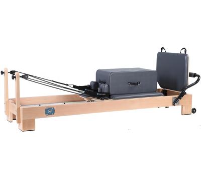 China Yoga Pilates Fitness Gym Customized Home Use Pilates Reformer Hot Selling Solid Wood Best Sports 230*68.5*31.5cm for sale