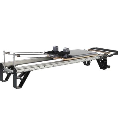 China Pilates Reformer Fitness Equipment Black Gym Body Customized Aluminum Reformer With Sliding Footbar Clinical Yoga Reformer 249*58.5*40cm for sale