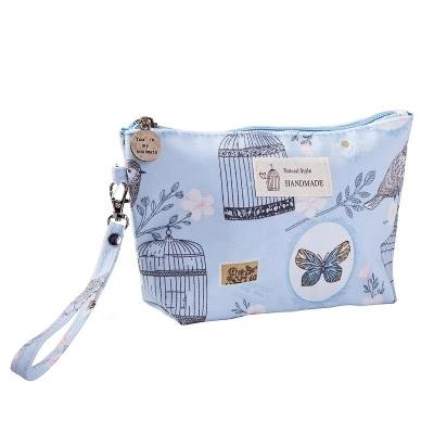 China Customized Durable and Lightweight Ladies Printed Portable Cosmetic Pouch Zipper Canvas Travel Toiletry Bag Waterproof Makeup Bag for sale