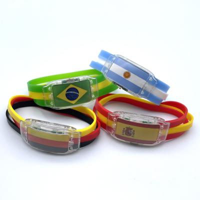 China 2022 Decoration World Cup Flag Bracelet American Brazil Football Team Flag Silicone Wristband Stage Luminous Atmosphere Led Lighting Props for sale